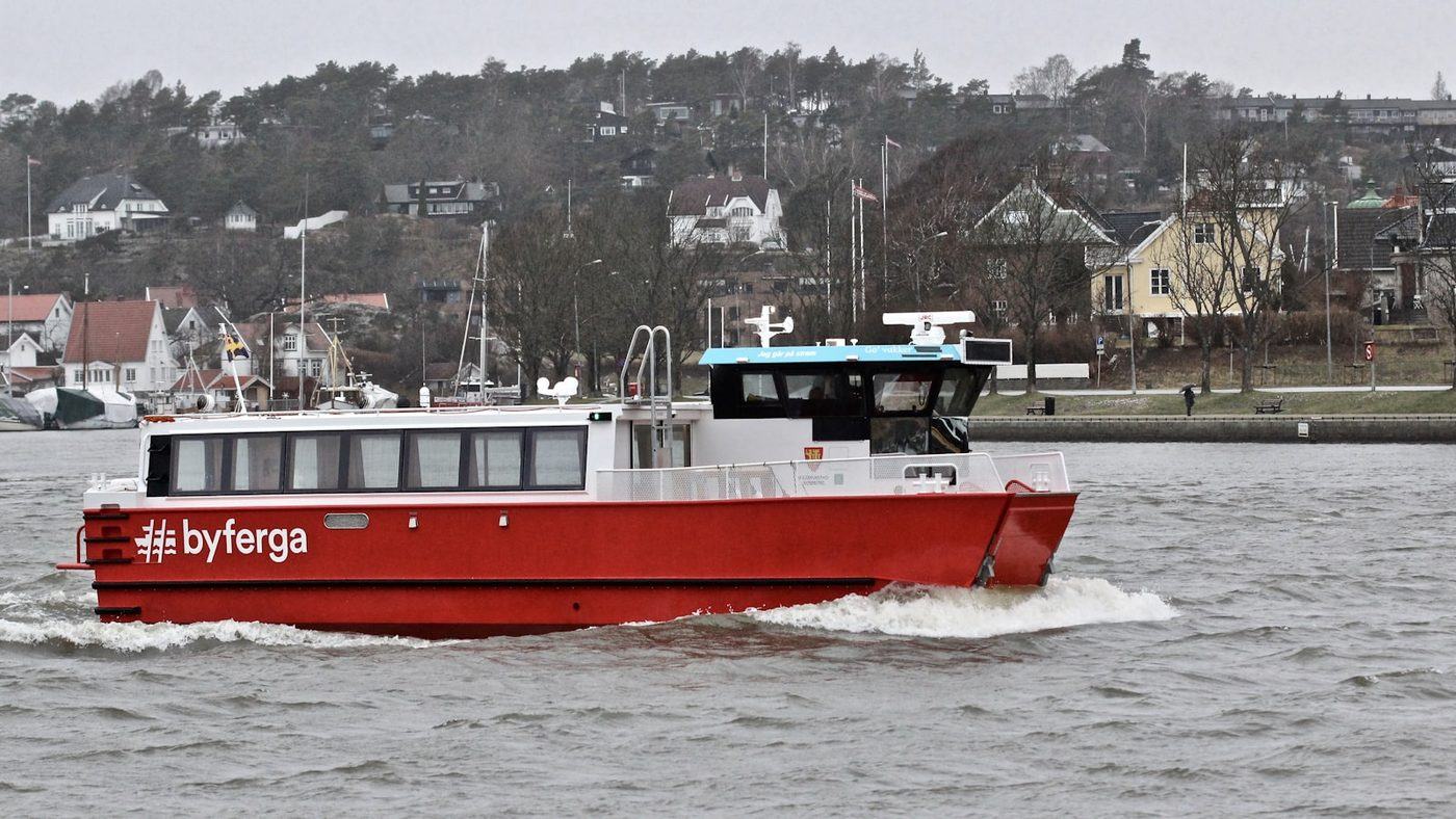 Red electric passenger ferry underway